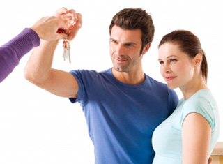 Young couple accepting a set of keys
